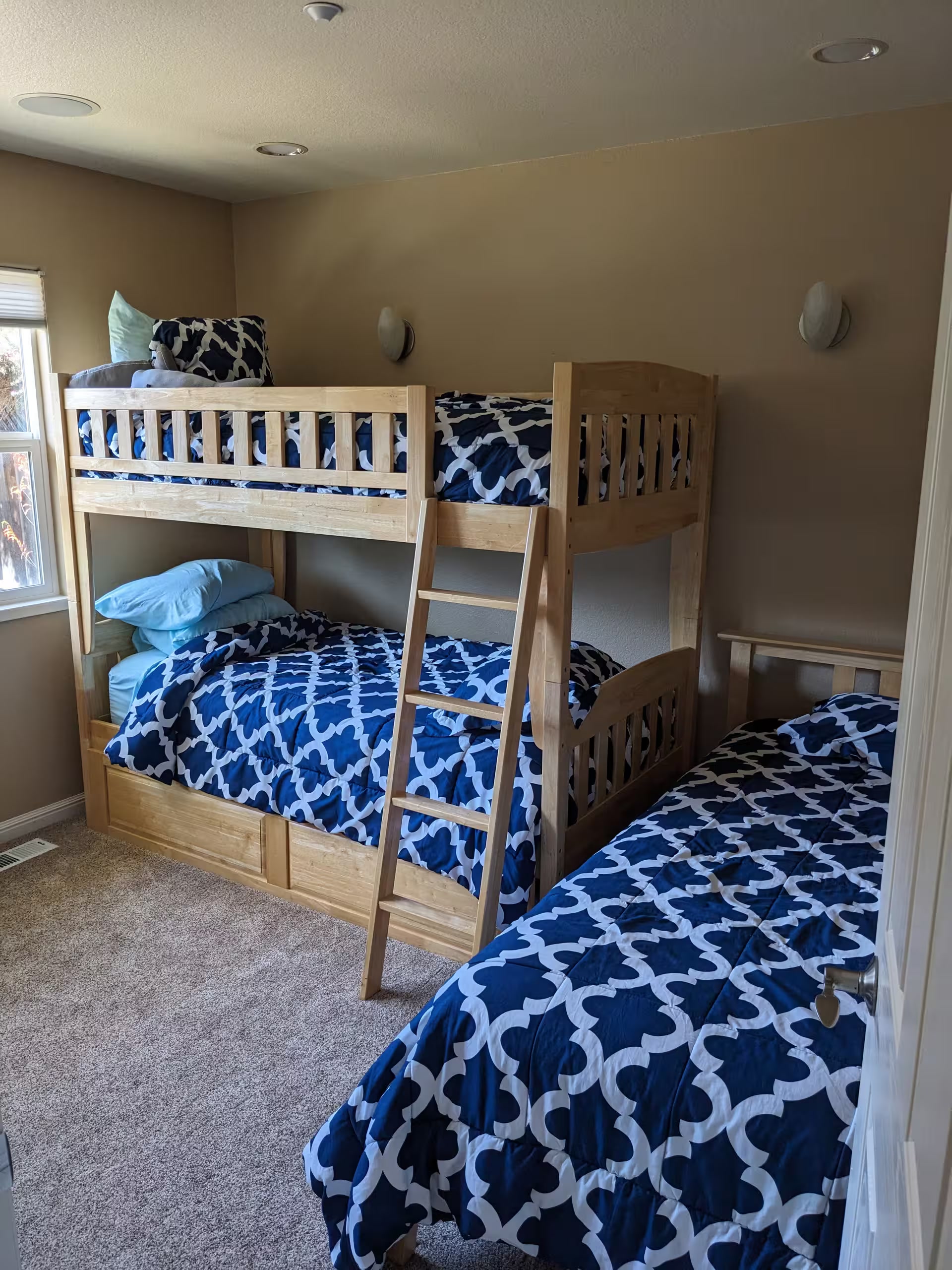 Kids’ bedroom with bunk beds and twin sleeping